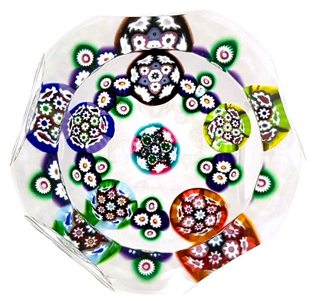 Made in 2025 by Peter Holmes, a center complex cane surrounded by a garland of unique complex canes with a top facet and 5 side facets for viewing. PH signature cane viewed from top down. Canes are reminiscent of the pieces Peter made for the Caithness jewelry line following Paul Ysart's departure. A bright and clean presenting weight.  3.25"