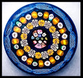 2025 Bright Millefiori canes on blue ground by Peter Holmes