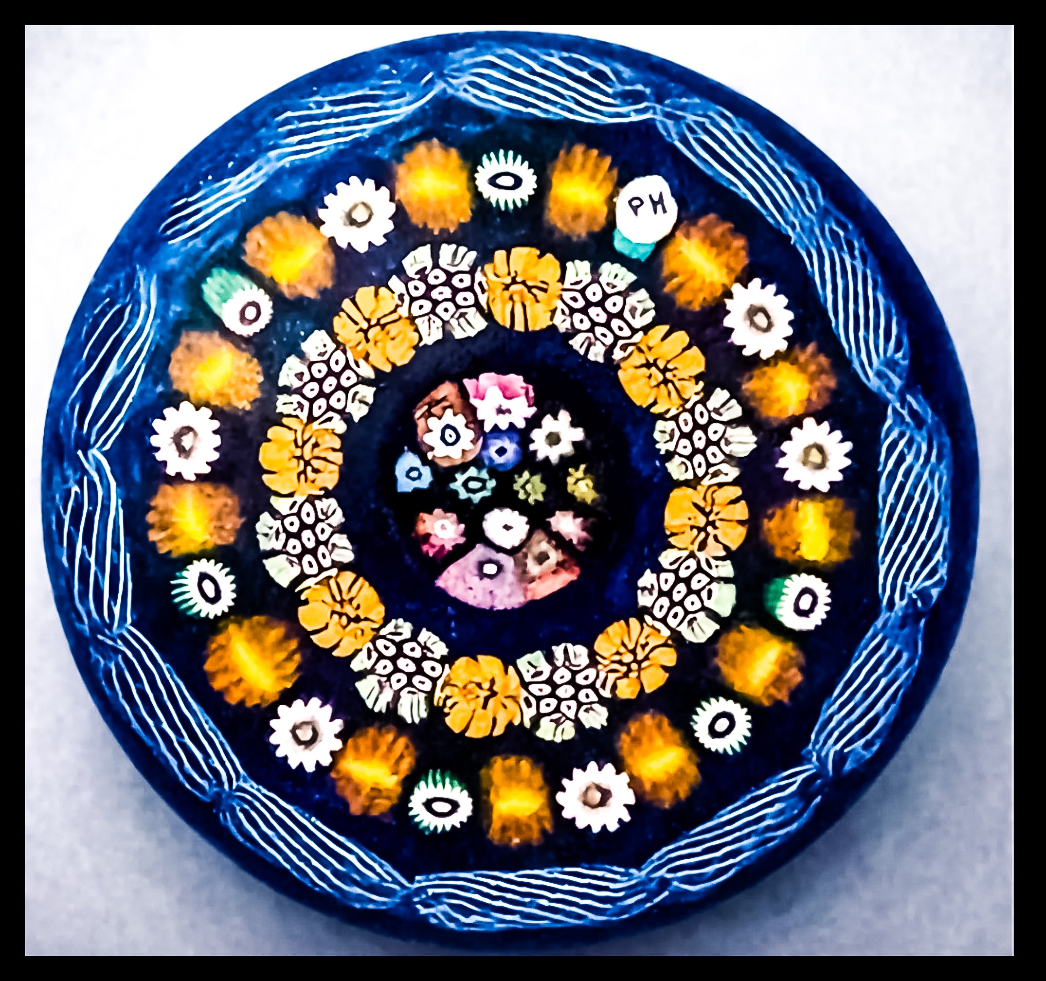 2025 Bright Millefiori canes on blue ground by Peter Holmes