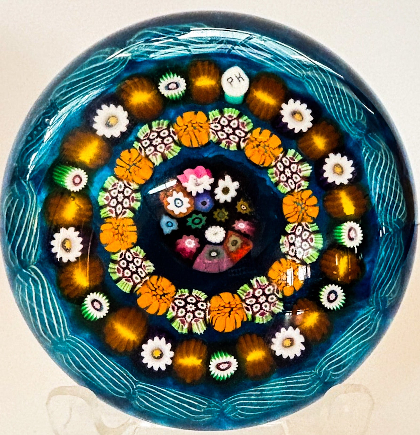 Made by Peter Holmes in 2025, reminds me of an early Paul Ysart, pre-war at Moncrieff with the color choice and layout, especially with the center complex cane arrangement and horizontal latticinio garland. Main difference with a PY period piece is Peter used regular sized canes instead of the behemoths used by PY pre-war. This weight exudes masculinity.&nbsp;