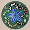 2025 Blue Flowerhead, cane garland on green ground by Peter Holmes