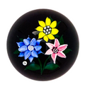 1979 J Glass Blue, yellow and pink flowerheads with stardust center canes atop an opaque black ground, J 1979 cane floats next to the blue flowerhead. Delicate lampwork at it;s finest with wonderfully cupped petals on each flower.&nbsp; A near perfect weight at a great price, easily one of the best among it's contemporaries in 1979.&nbsp; 2 1/4"