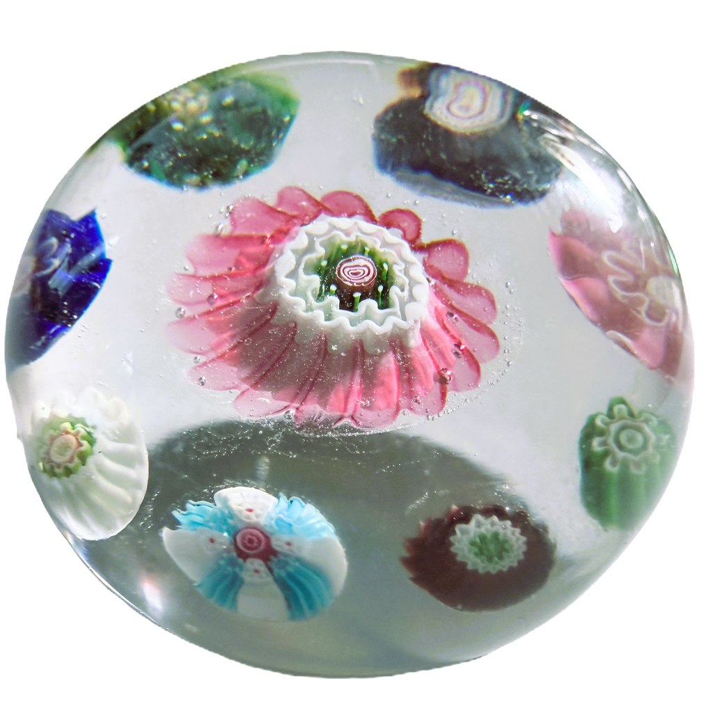 Antique Clichy concentric on clear ground. 8 pastry mold complex canes surrounding a very large lovely pink center pastry mold complex cane. a tall dome on this mini. 1.65"