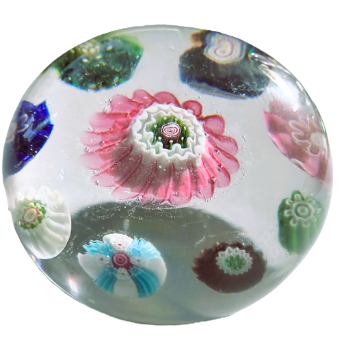 Antique Clichy concentric on clear ground. 8 pastry mold complex canes surrounding a very large lovely pink center pastry mold complex cane. a tall dome on this mini. 1.65"