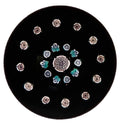 John Deacons medium concentric paperweight with a a Clichy rose style center cane surrounded by a concentric ring of alternating Clichy style rose canes and unique flower canes. The outermost ring is a garland of Clichy style roses, bringing the total to 18 Clichy style roses. Motif sits atop a dark purple opaque ground. JMD 2008 with heart outline signature cane on base. 2.9”