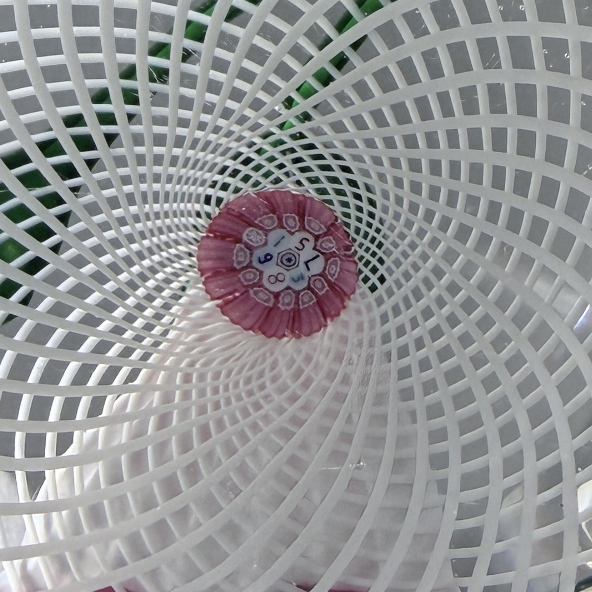 1983 Saint Louis Faceted Trumpet Flower-white tubular flower with red rim, dark green stem a closed bud atop a double latticinio basket, 6 large side facets and one large facet on top for viewing, SL date cane in the base. Very faint basal ring. Excellent condition. 3"
