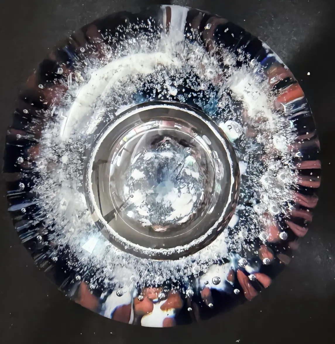 Made in 2025 vy Peter Holmes, Silver Planet -a Silver bubble rises from the planet surface gathering energy and particles as it gathers pace. This us UV/sunlight reactive. Number 5 of an edition of 5. 3.2"