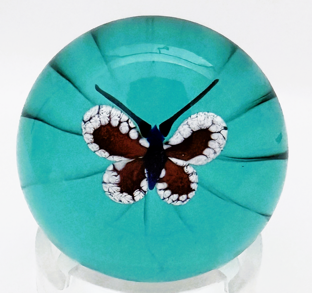 A 2025 William Manson aventurine butterfly on translucent teal ground. 2". Scratch signed on starcut base.