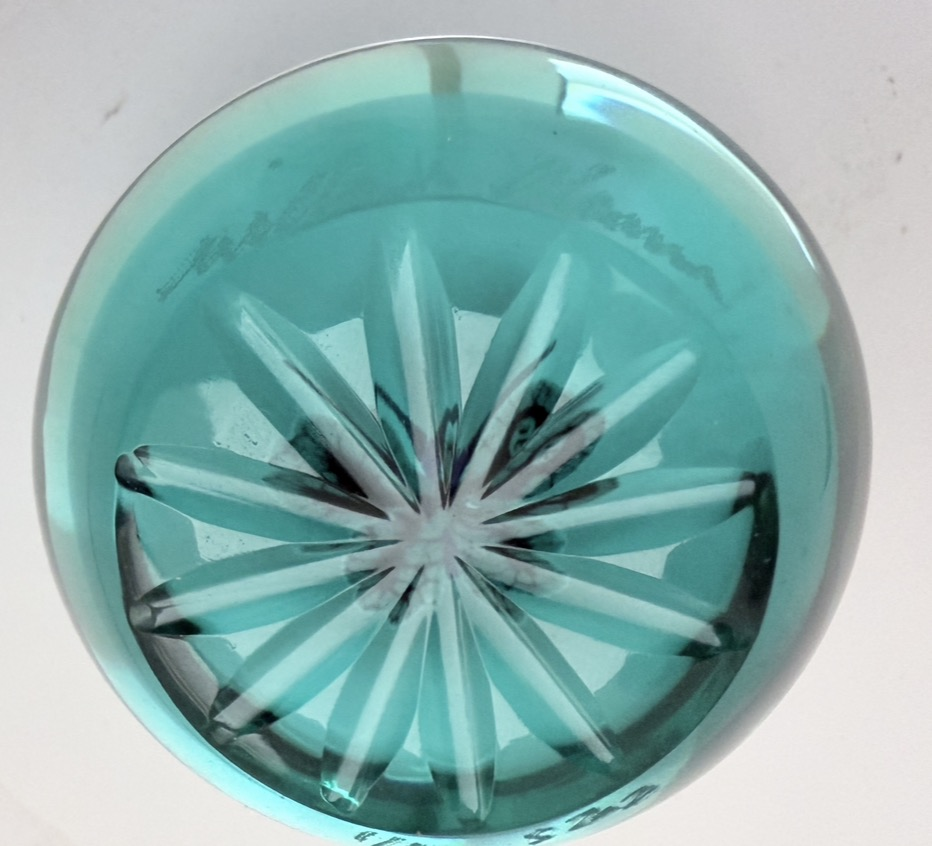 A 2025 William Manson aventurine butterfly on translucent teal ground. 2". Scratch signed on starcut base.