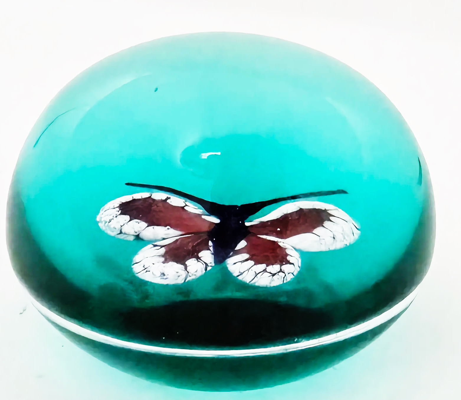 A 2025 William Manson aventurine butterfly on translucent teal ground. 2". Scratch signed on starcut base.