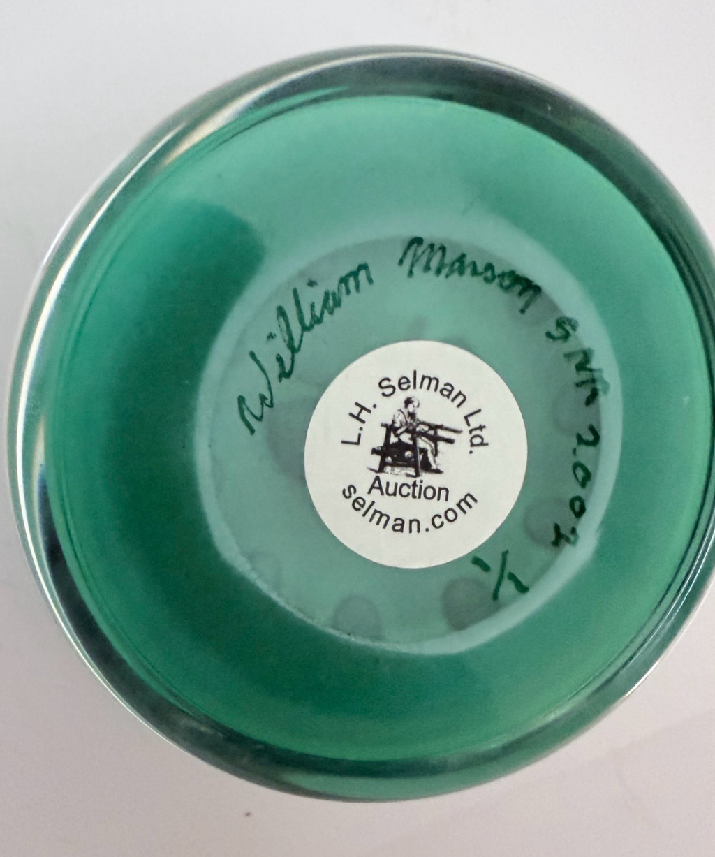 A 2002 William Manson Snr. 1/1 aventurine butterfly on a nice opaque teal ground surrounded by a cane garland. 2.7". Scratch signed on base.