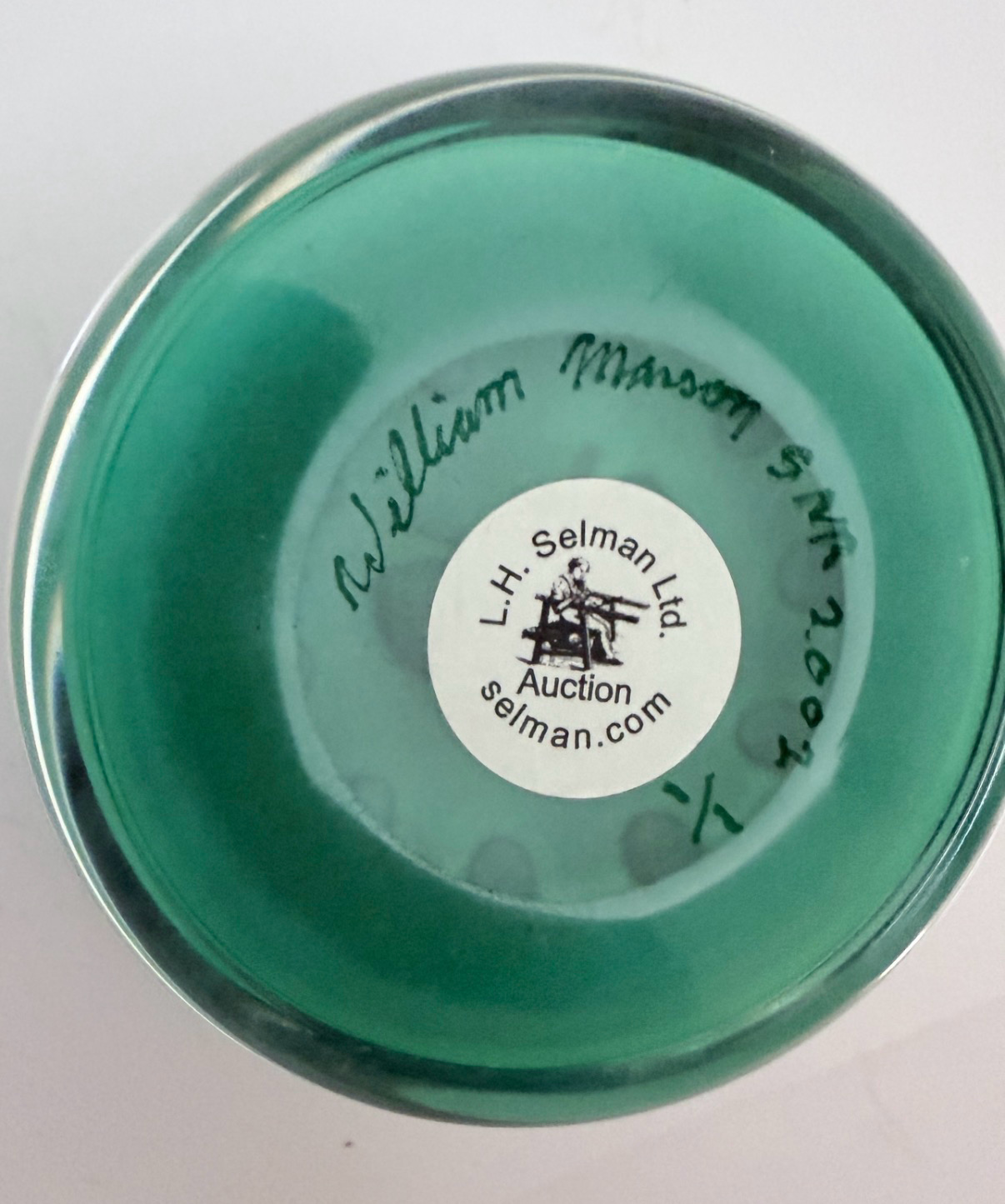 A 2002 William Manson Snr. 1/1 aventurine butterfly on a nice opaque teal ground surrounded by a cane garland. 2.7". Scratch signed on base.